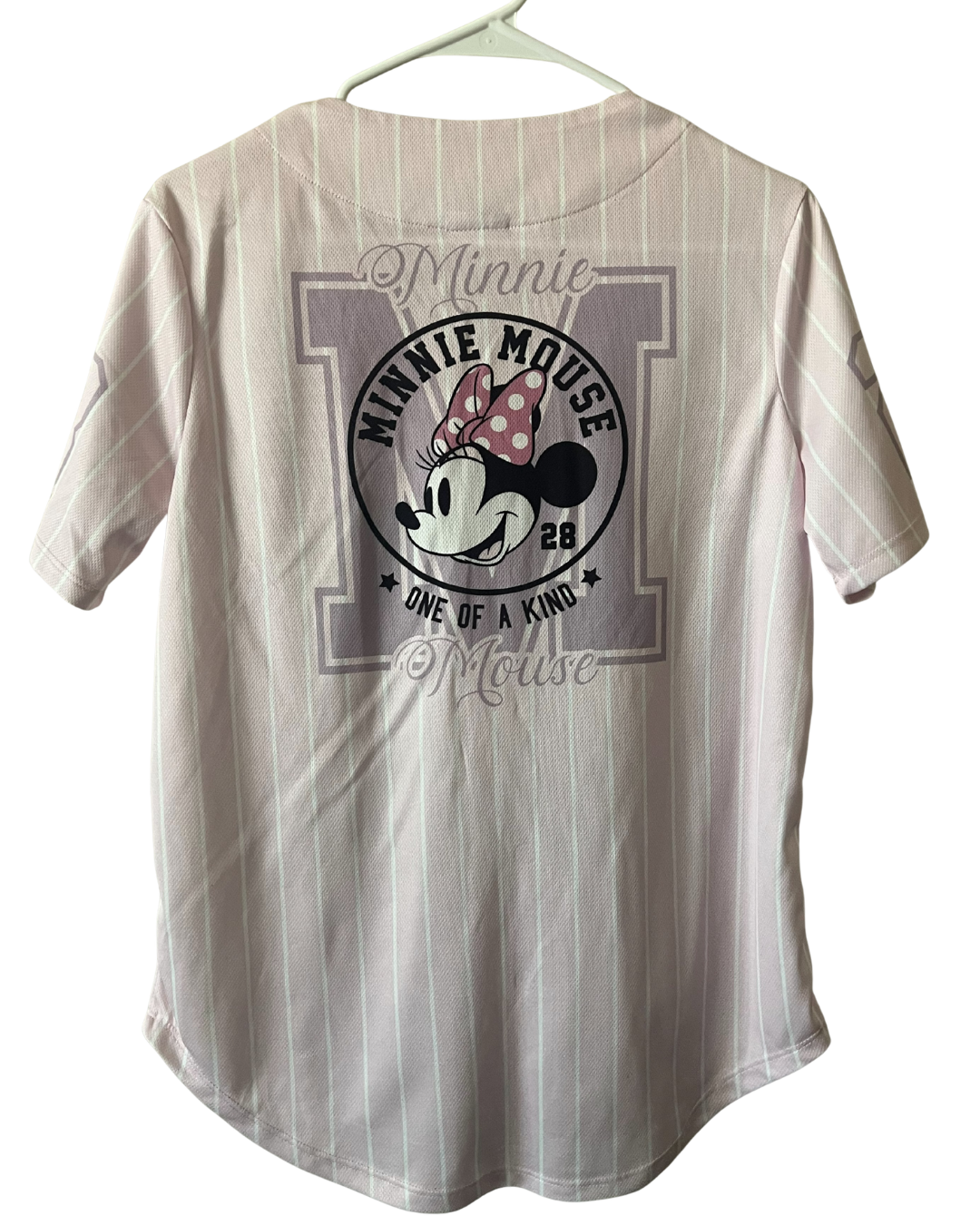 A short-sleeve t-shirt featuring a large Minnie Mouse graphic on the back, set against a white background with subtle vertical stripes.